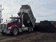 Soil being loaded onto a barge, headed for Haida Gwaii